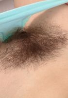Kitty shows her hairy legs and full bush., Kitty (kit027) ATK Natural & Hairy: Kitty (Kitty shows her hairy legs and full bush.)